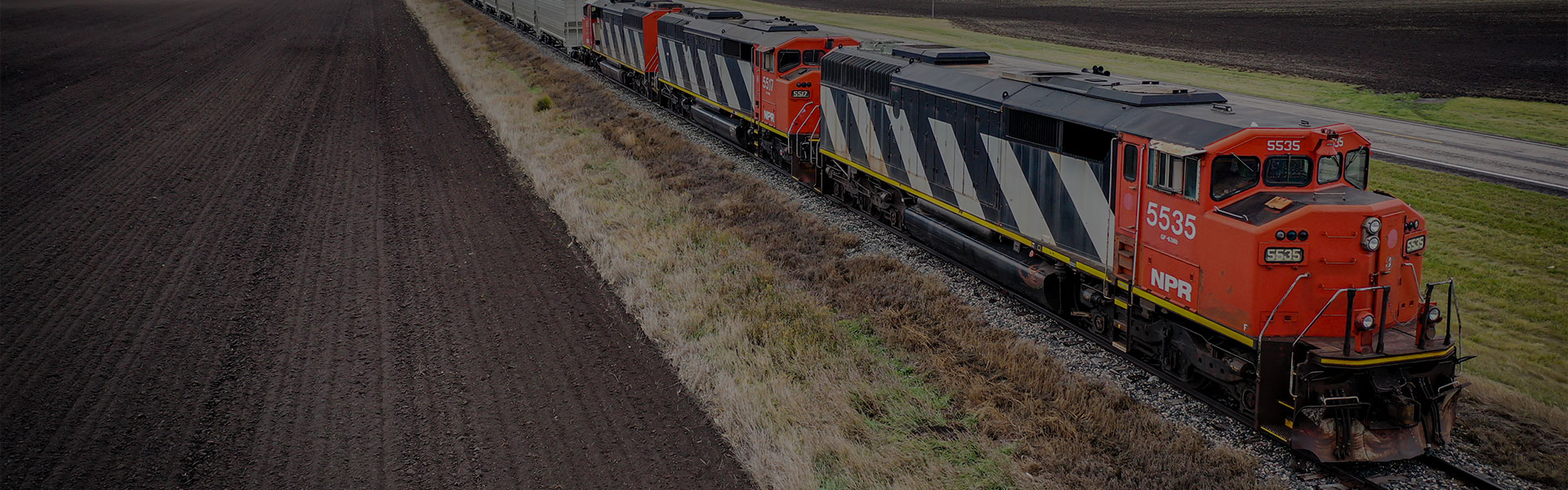 A Northern Plains Railroad train traveling in a rural area